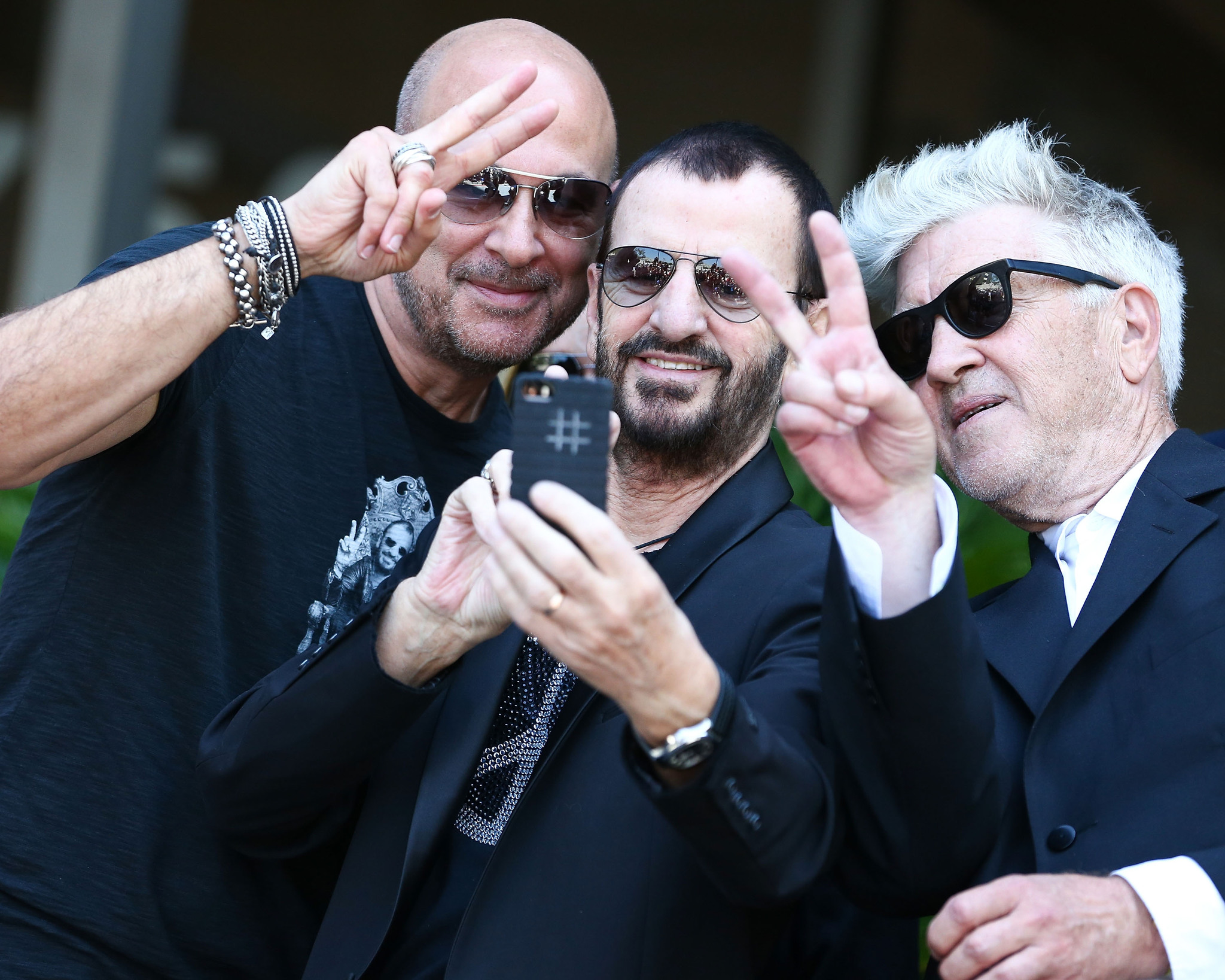 Designer John Varvatos, musician Ringo Starr, and director David Lynch attend the announcement of special collaboration of John Varvatos and Ringo Starr on occasion of Ringo's birthday at Capitol Records Studio on July 7, 2014 in Hollywood, California.