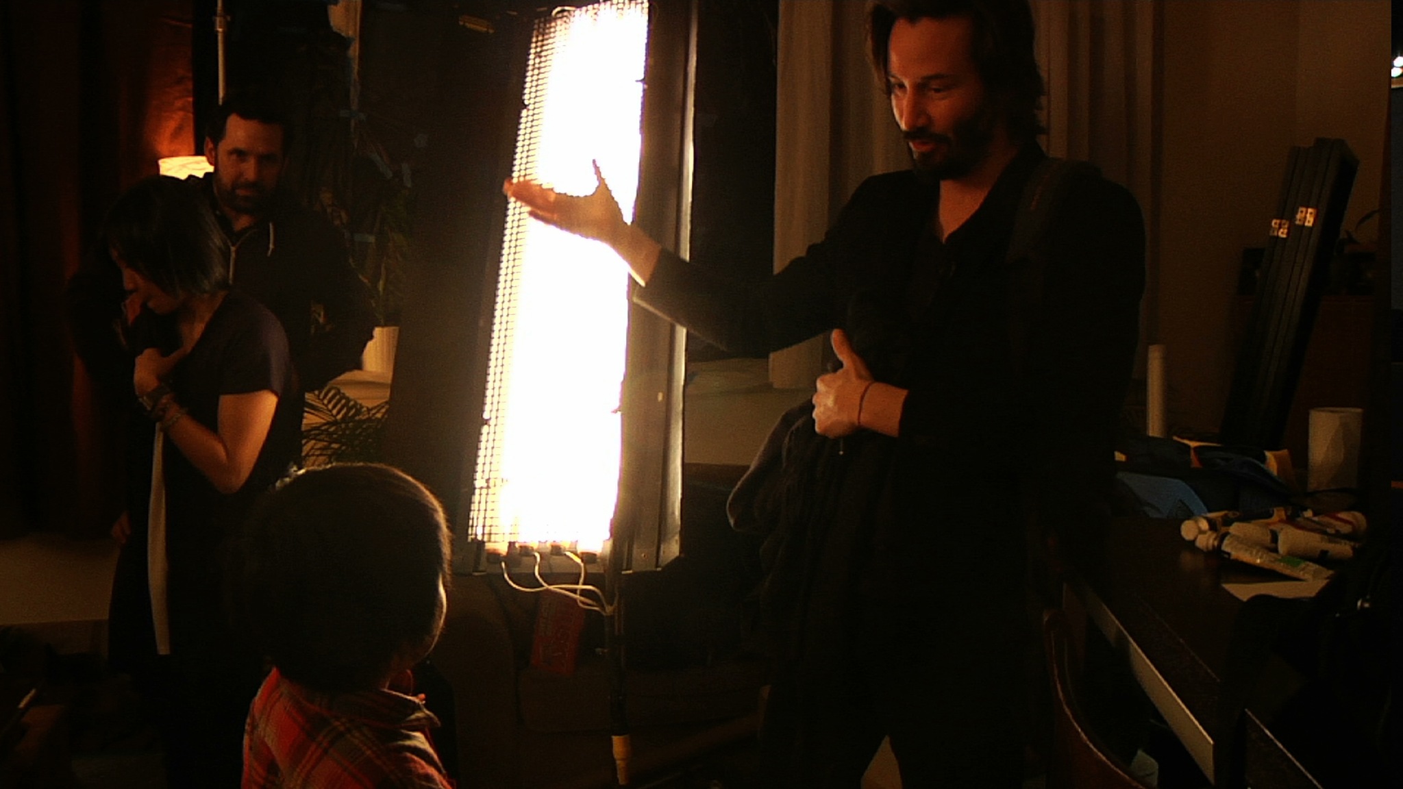 Still of Keanu Reeves and Brennan-Pierson Wang in Side by Side (2012)