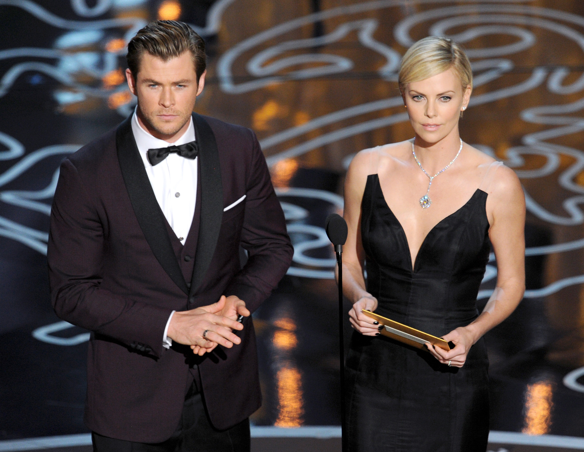 Charlize Theron and Chris Hemsworth at event of The Oscars (2014)