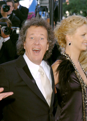 Charlize Theron and Geoffrey Rush at event of The Life and Death of Peter Sellers (2004)