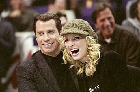 JOHN TRAVOLTA and UMA THURMAN star as Chili Palmer and Edie Athens in MGM Pictures' comedy BE COOL.