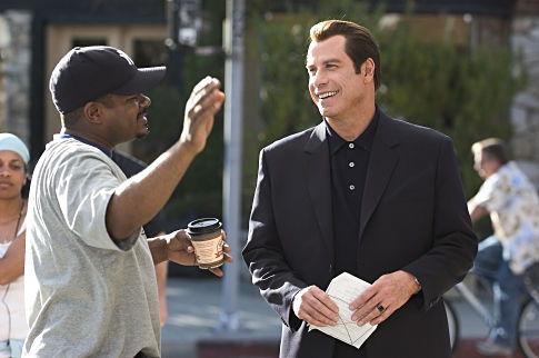 Director F. GARY GRAY and JOHN TRAVOLTA on the set of MGM Pictures' comedy BE COOL.