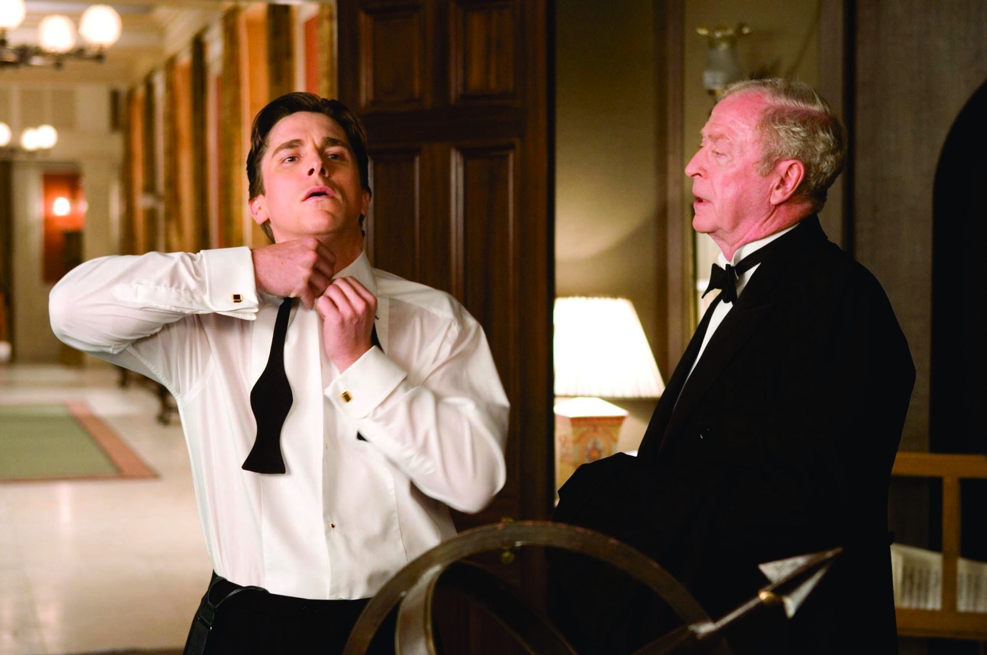 Still of Christian Bale and Michael Caine in Betmenas: Pradzia (2005)