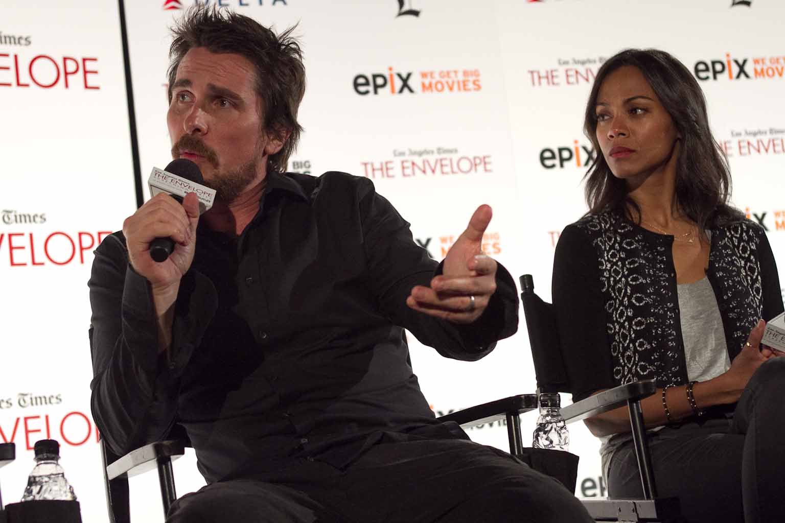 Christian Bale and Zoe Saldana at event of Out of the Furnace (2013)