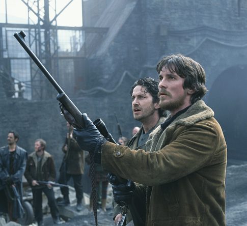 Quinn (Christian Bale, right) and his right-hand man, Creedy (Gerard Butler, left) stand guard over a castle that houses some of the last survivors on earth