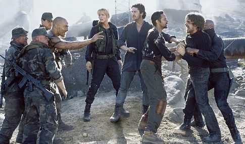 (Left to right): Van Zan (Matthew McConaughey) (third from left), Alex Jensen (Izabella Scorupco), Creedy (Gerard Butler), Ajay (Alexander Siddig), Quinn (Christian Bale), Gideon (Terence Maynard).