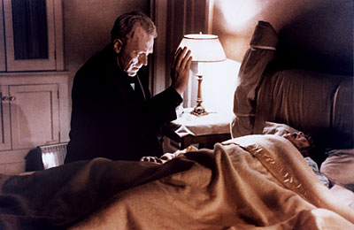 Father Merrin prays at Regan's bedside