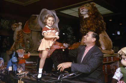 Ernest Borgnine and daughter Nancee at Uncle Bernie's Toy Menagerie Beverly Hills, CA 1957