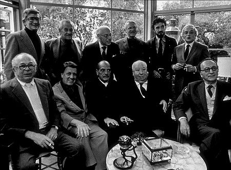Directors Group, Nov. 1972. George Cukor Hosts a party for Luis Bunuel. Back Row from left: Robert Mulligan, William Wyler, George Cukor, Robert Wise, Jean-Claude Carriere, and Serge Silverman. Front Row from left: Billy Wilder, George Stevens, Luis Bunuel, Alfred Hitchcock, and Rouben Mamoulin.