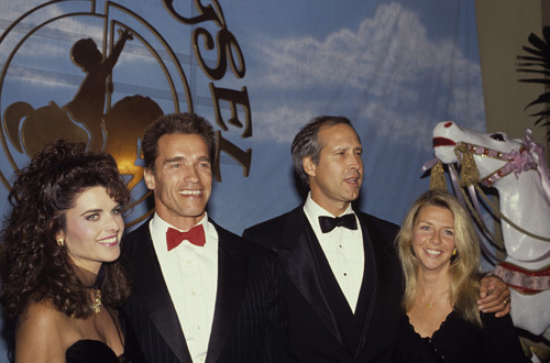 Arnold Schwarzenegger and Maria Shriver with Chevy Chase and his wife Jayni at a 