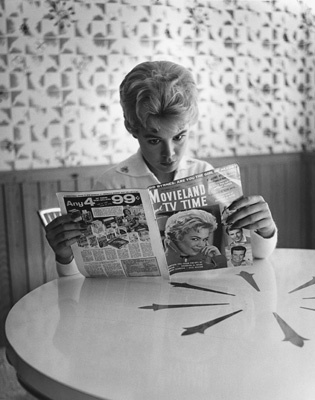 Sandra Dee at home reading a fan magazine circa 1956