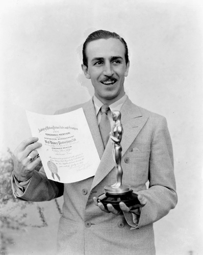 Walt Disney poses with his first oscar, mid 30's, I.V.