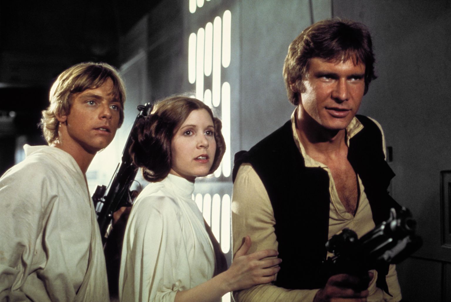 Still of Harrison Ford, Carrie Fisher and Mark Hamill in Zvaigzdziu karai (1977)
