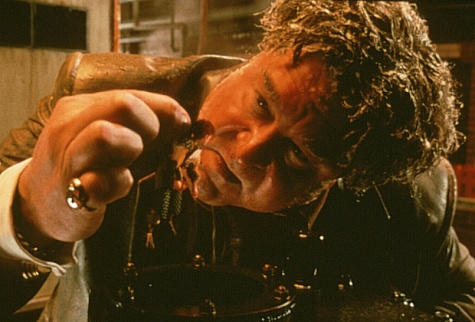 Ocious P. Potter (John Goodman) displays his unique extermination technique on Spiller.