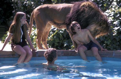 Melanie Griffith at home with her pet lion