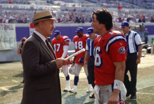 Gene Hackman as Coach McGinty and Keanu Reeves as Shane Falso