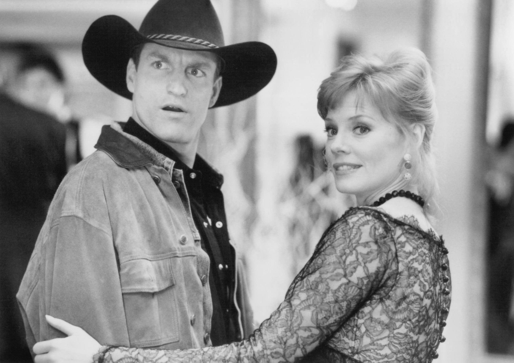 Still of Woody Harrelson and Marg Helgenberger in The Cowboy Way (1994)