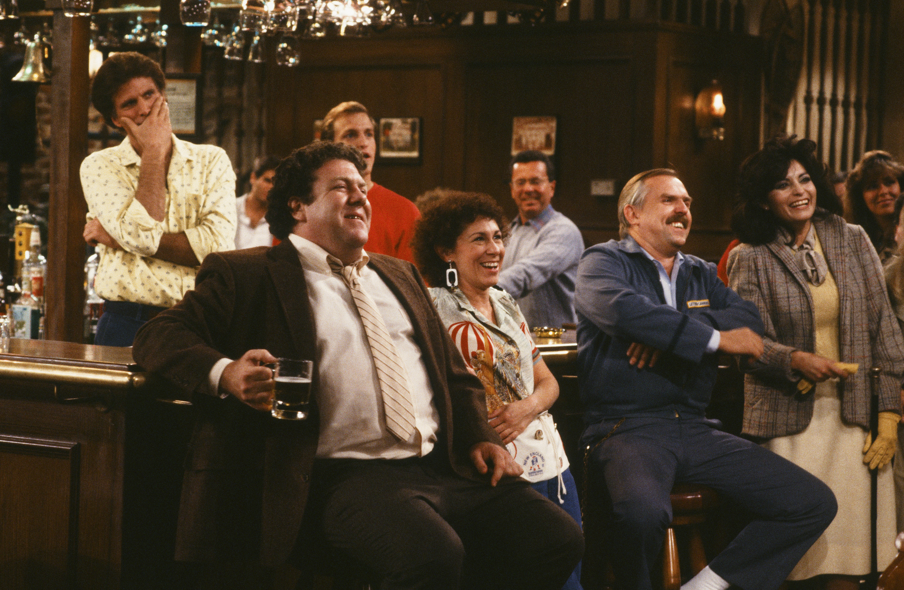 Still of Woody Harrelson, Ted Danson, John Ratzenberger, George Wendt and Rhea Perlman in Cheers (1982)