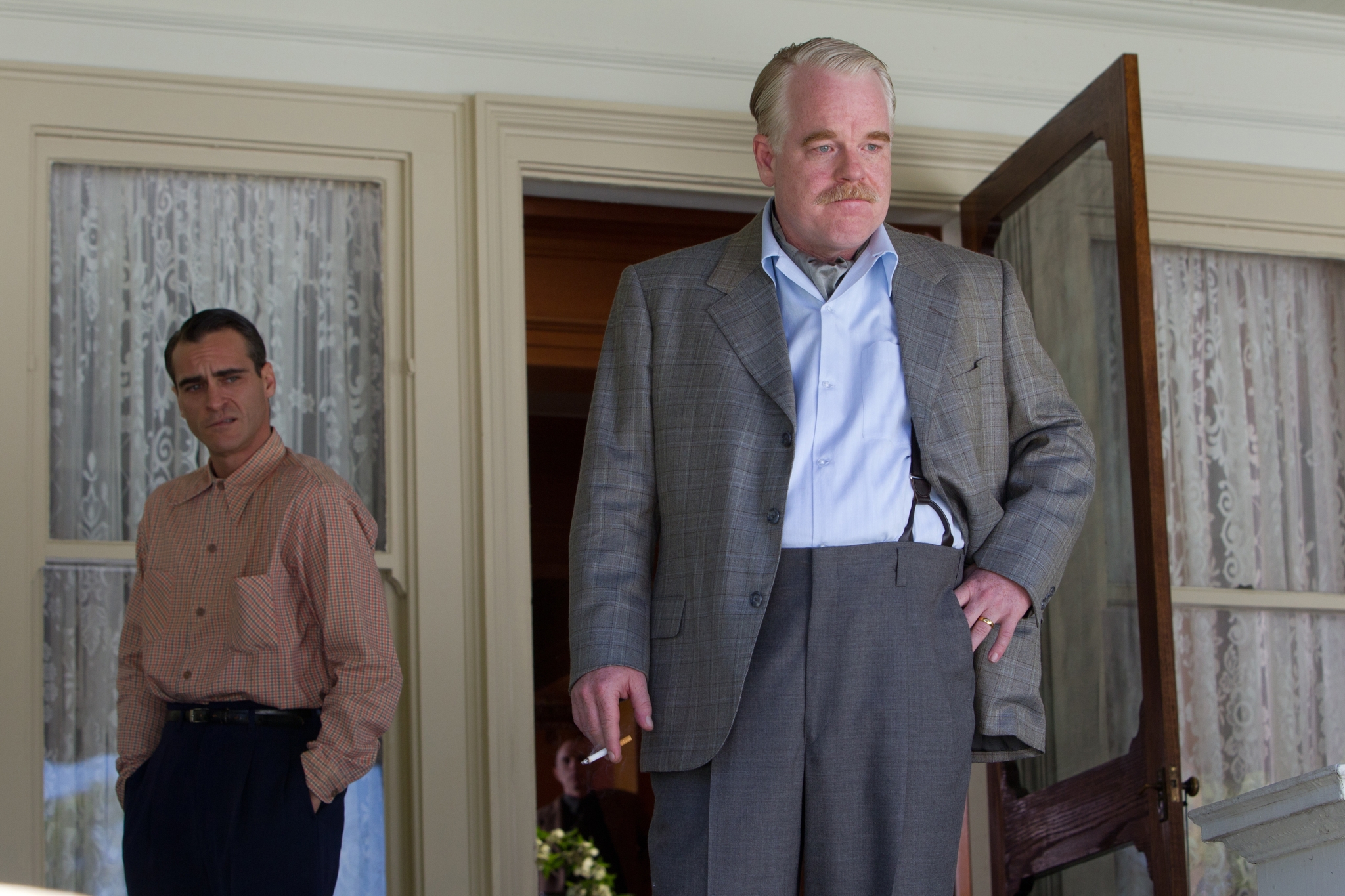 Still of Philip Seymour Hoffman and Joaquin Phoenix in The Master (2012)