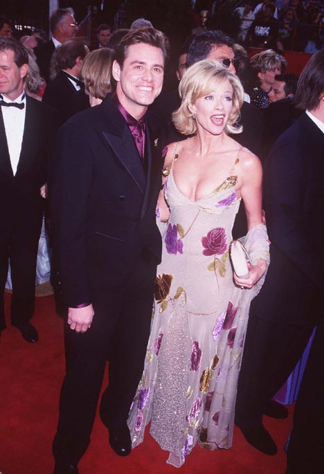 Jim Carrey and Lauren Holly at event of The 69th Annual Academy Awards (1997)