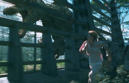 Amanda Kirby tries to outrun the Spinosaurus