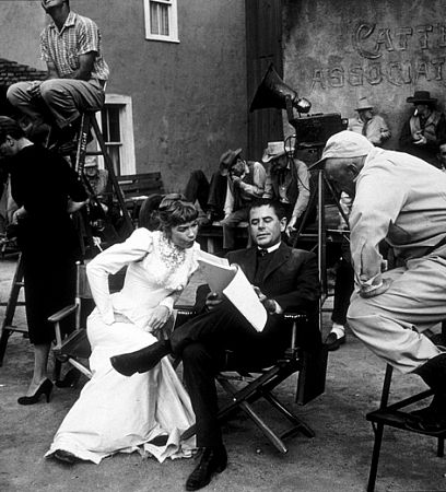 Glenn Ford with Shirley MacLaine and director, George Marshall, on the set of 