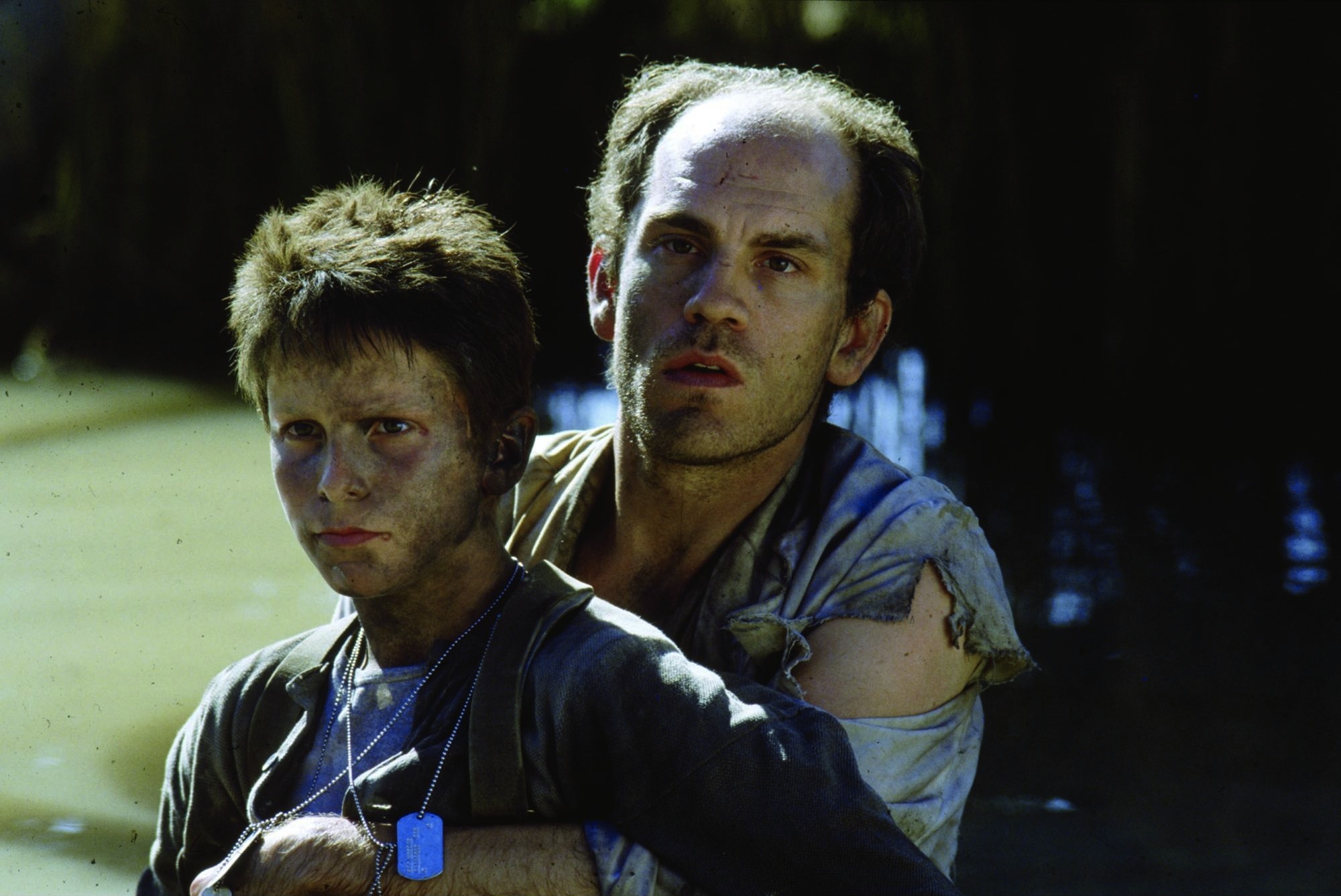 Still of Christian Bale and John Malkovich in Saules imperija (1987)