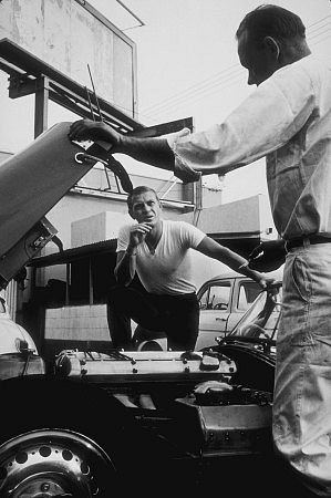 Steve McQueen talking to his XKSS Jaguar mechanic