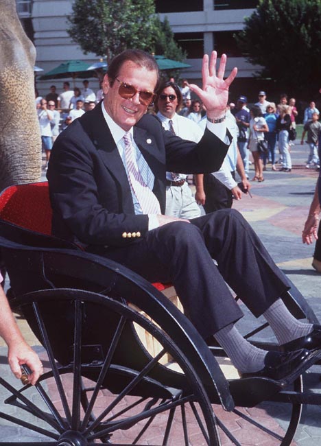 Roger Moore at event of The Quest (1996)