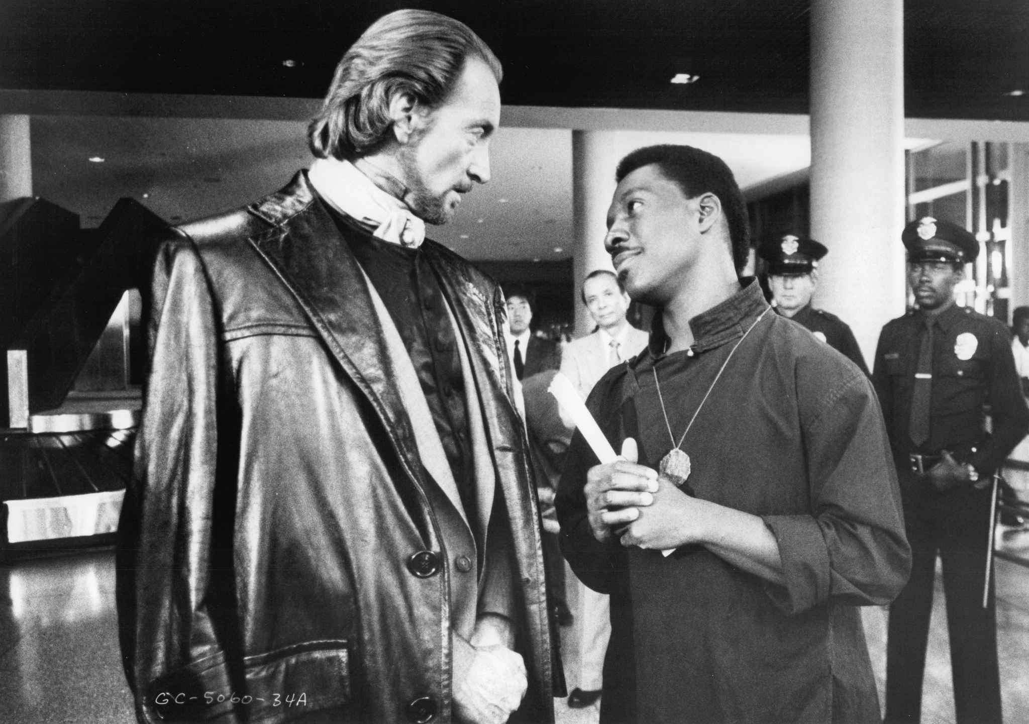 Still of Eddie Murphy and Charles Dance in The Golden Child (1986)