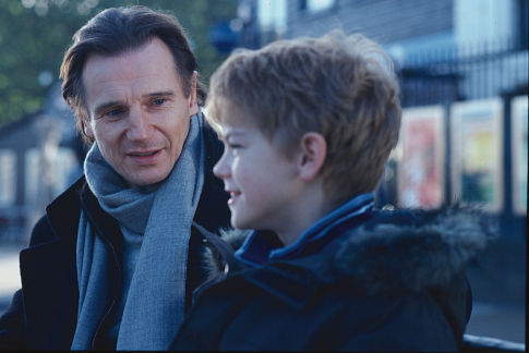 Sam (THOMAS SANGSTER) opens up to his stepfather Daniel (LIAM NEESON) in Richard Curtis' romantic comedy Love Actually.