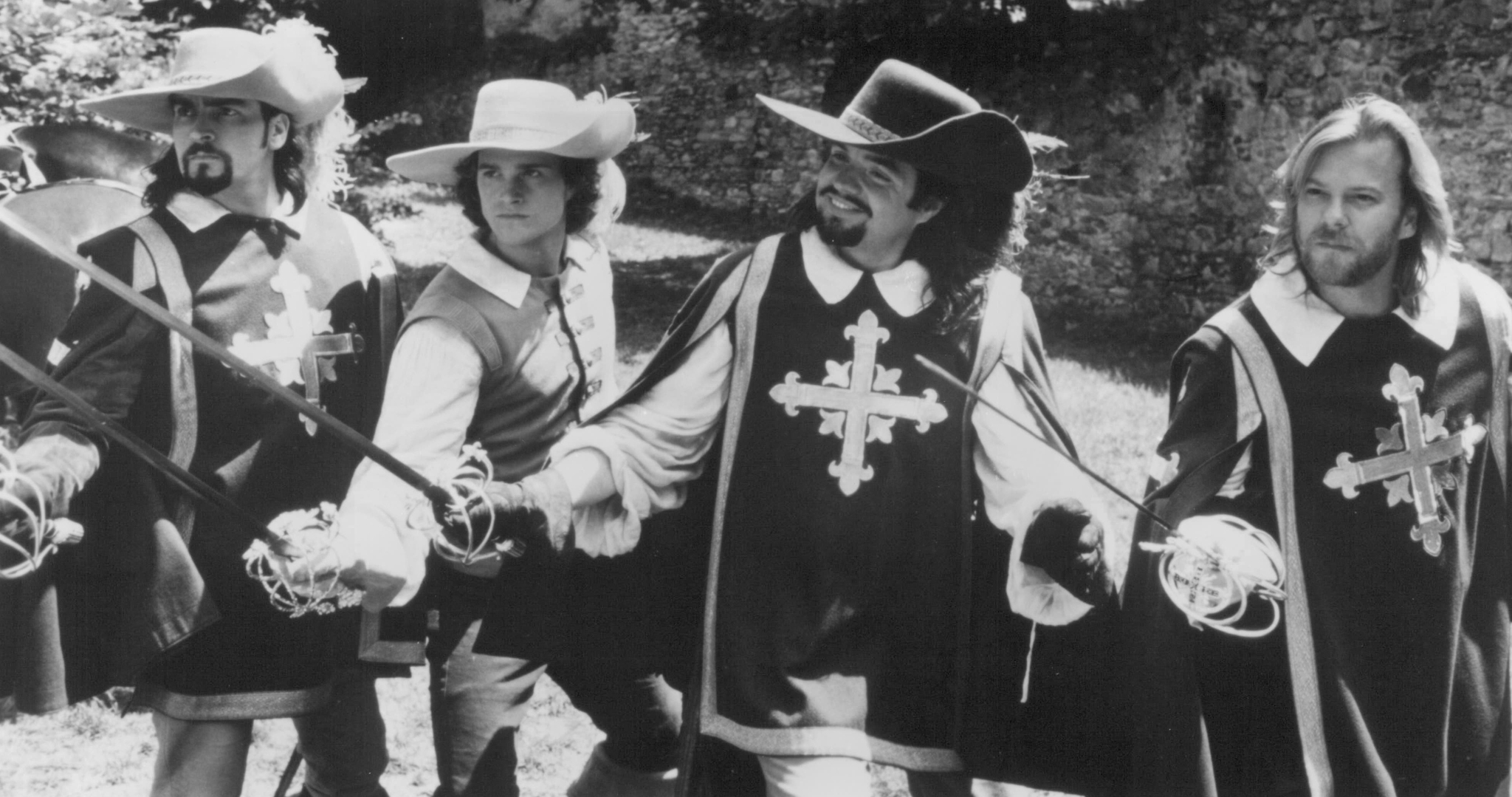 Still of Charlie Sheen, Chris O'Donnell, Kiefer Sutherland and Oliver Platt in The Three Musketeers (1993)