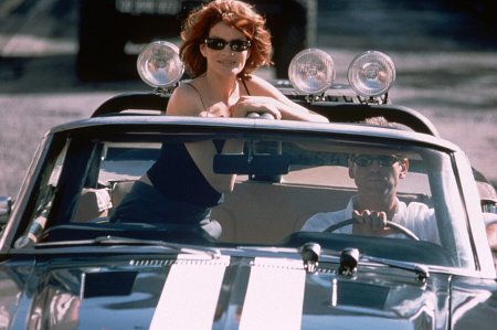 Still of Pierce Brosnan and Rene Russo in Tomo Krauno afera (1999)