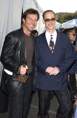 Dennis Quaid and John Waters