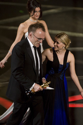 Academy Award®-winner Danny Boyle (left) with presenter Reese Witherspoon telecast at the 81st Academy Awards® are presented live on the ABC Television network from The Kodak Theatre in Hollywood, CA, Sunday, February 22, 2009.