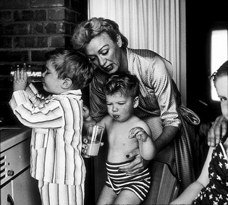 Eve Arden with her children, Douglas, Duncan, and Connie, in their kitchen, 1956.