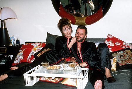 Ringo Starr and Wife Barbara Bach having a little snack in bed.