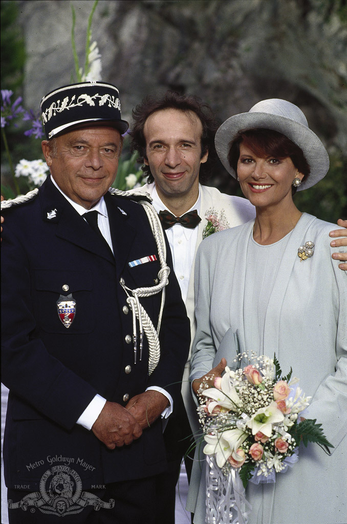Still of Roberto Benigni, Claudia Cardinale and Herbert Lom in Son of the Pink Panther (1993)