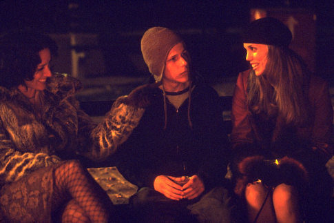 Sophie (Jennifer Beals, left) and Andrea (Elizabeth Berkley, right) give Nick (Jesse Eisenberg) an experience he'll never forget