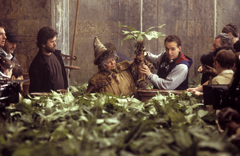 Director CHRIS COLUMBUS (right) and Professor Sprout (MIRIAM MARGOLYES) hold up a Mandrake.