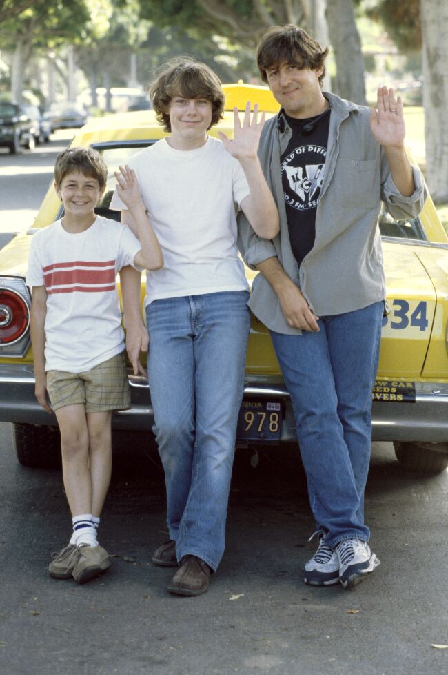 Both the young and old versions of William pose with director Cameron Crowe