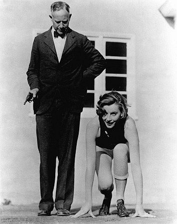 Greta Garbo with USC track coach Dean Cromwell, c. 1923.