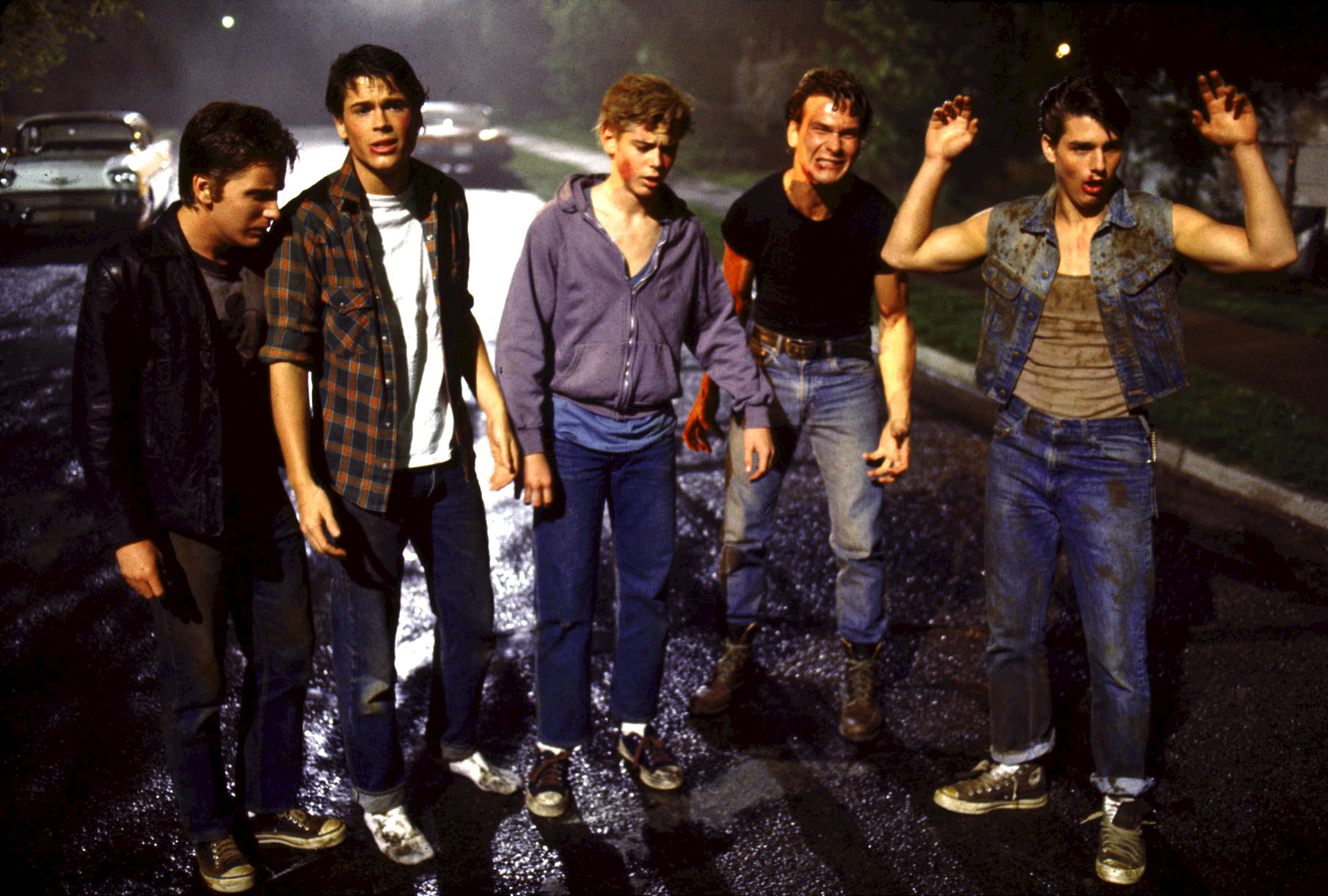 Still of Tom Cruise, Emilio Estevez, Rob Lowe, Patrick Swayze and C. Thomas Howell in The Outsiders (1983)