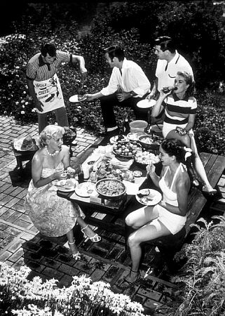 Rock Hudson at home with (clockwise) Bob Preble (actor), Leonard Stern (script writer), Lori Nelson (actress), Julia Adams (actress), and Betty Abbott (script girl), North Hollywood, CA, 1952.