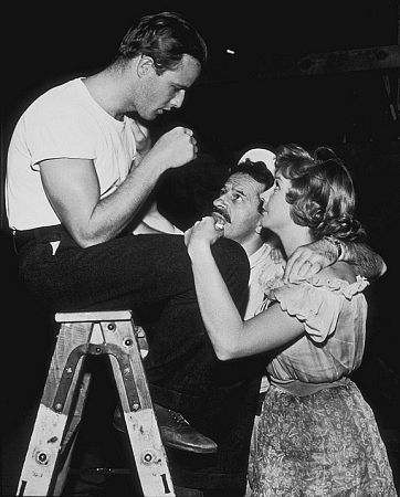 Marlon Brando with Nick Dennis and Kim Hunter on the set of 