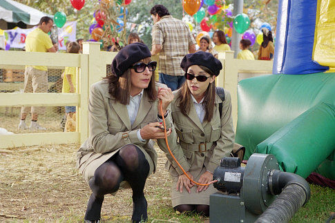 A harsh headmistress played by Anjelica Huston, left, tries to sabotage a rival day care facility with the help of her assistant, played by Lacey Chabert.