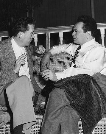 Edward G. Robinson with Director John Huston behind the scene of 