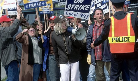 At a labor rally she's supposed to be covering for the evening news, an inebriated Lanie (ANGELINA JOLIE) leads picketing union members in an impromptu rendition of The Rolling Stones' (