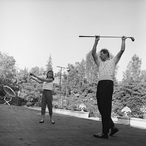 Danny Kaye stretching with his daughter Dena