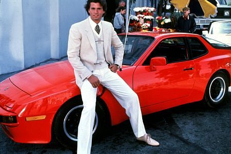 LORENZO LAMAS ON THE SET OF FALCON CREST WITH HIS PORSCHE 944 / 1983